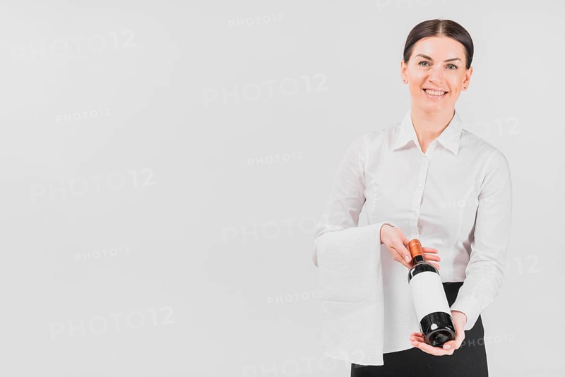 Waitress woman offering bottle wine