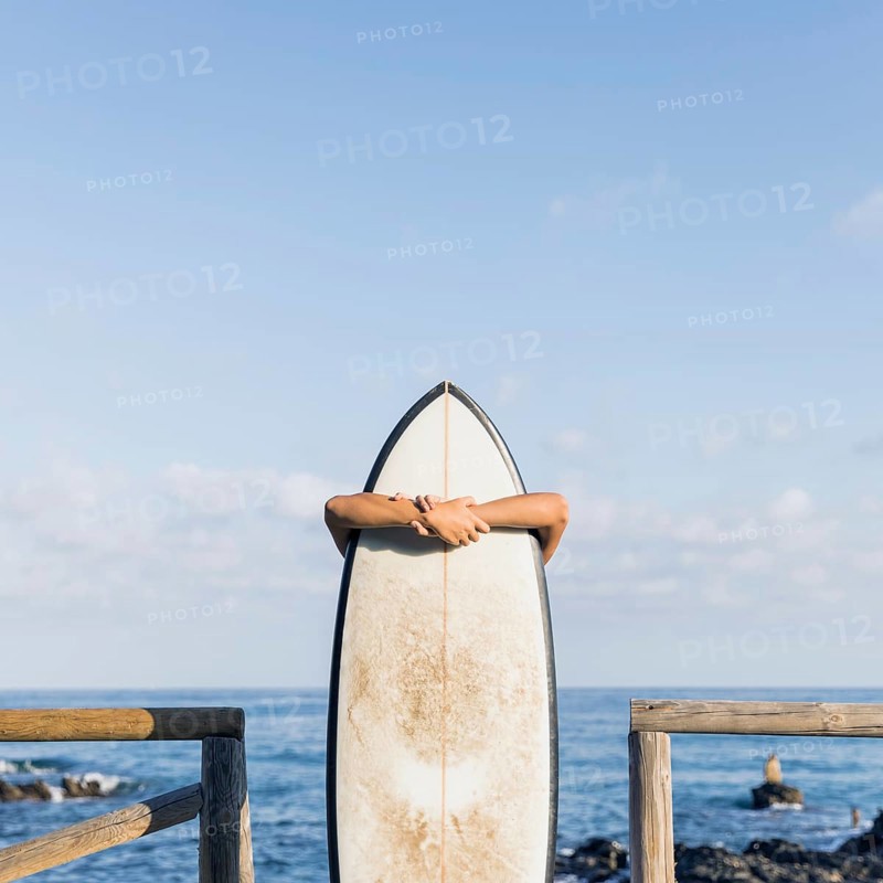 Woman with surfboard beach