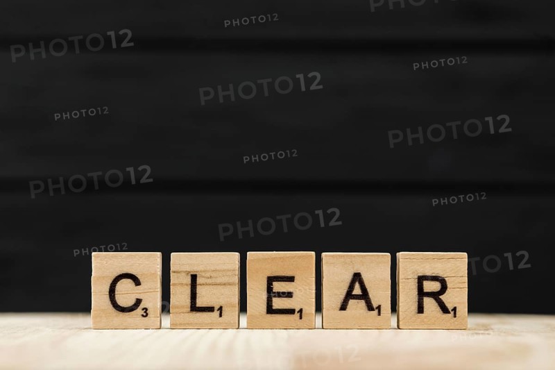 Word clear spelt with wooden letters