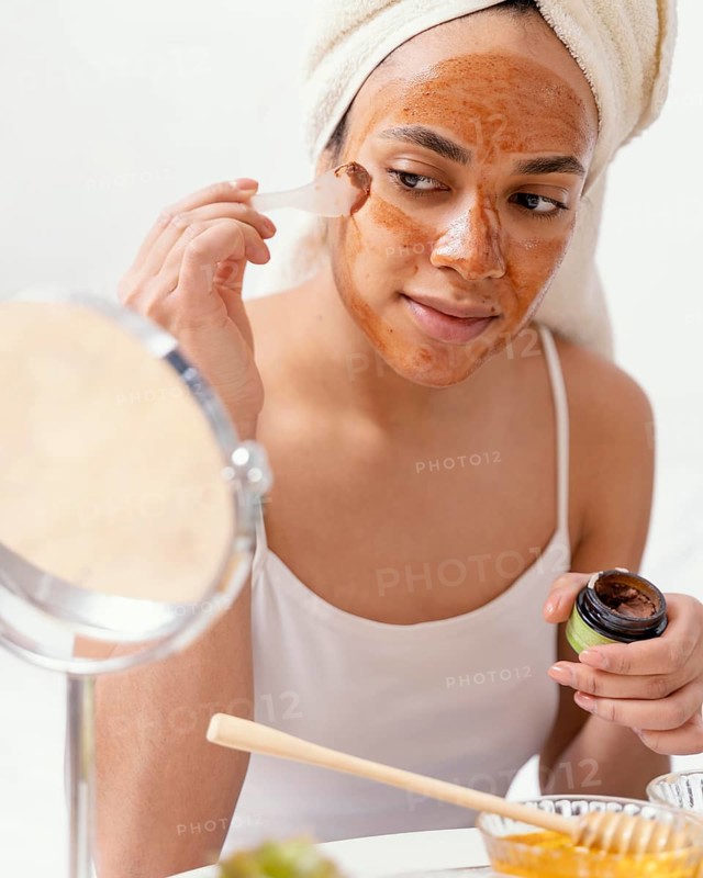 Young woman applying natural face mask 3