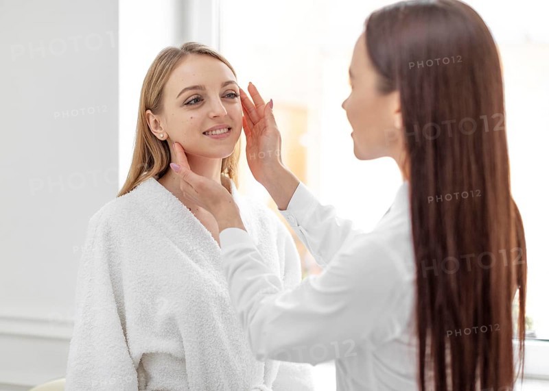 Beautician woman clinic consults client 4