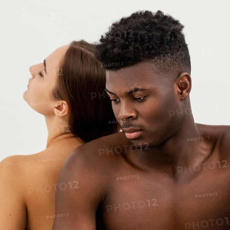 Black man white woman posing close up