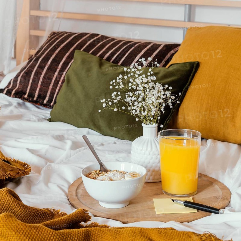 Breakfast bed with juice glass