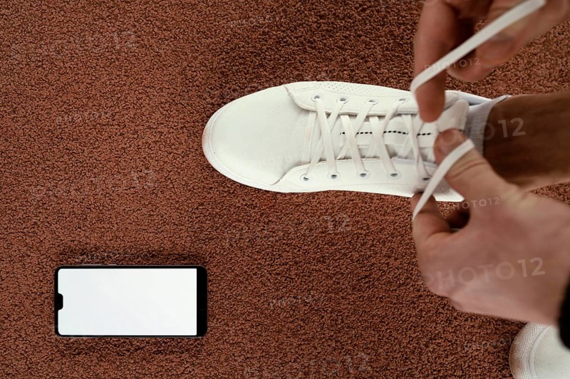 Close up athlete tying shoelaces