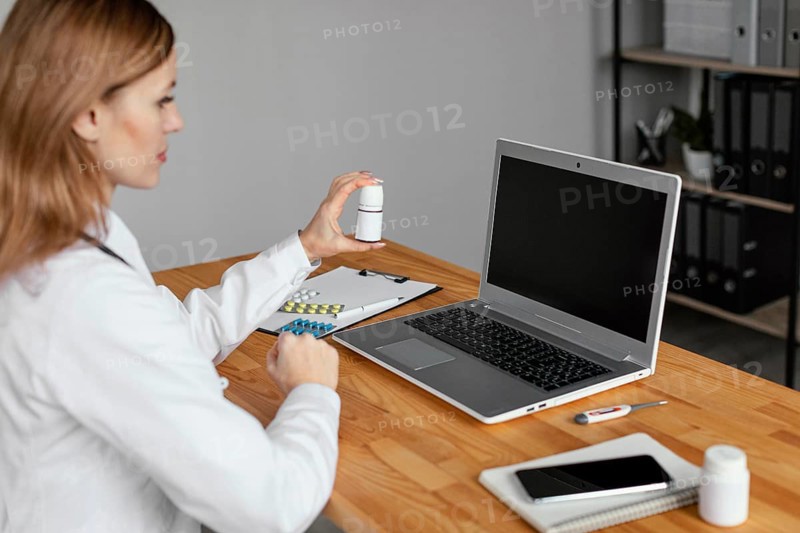 Close up doctor holding medicine