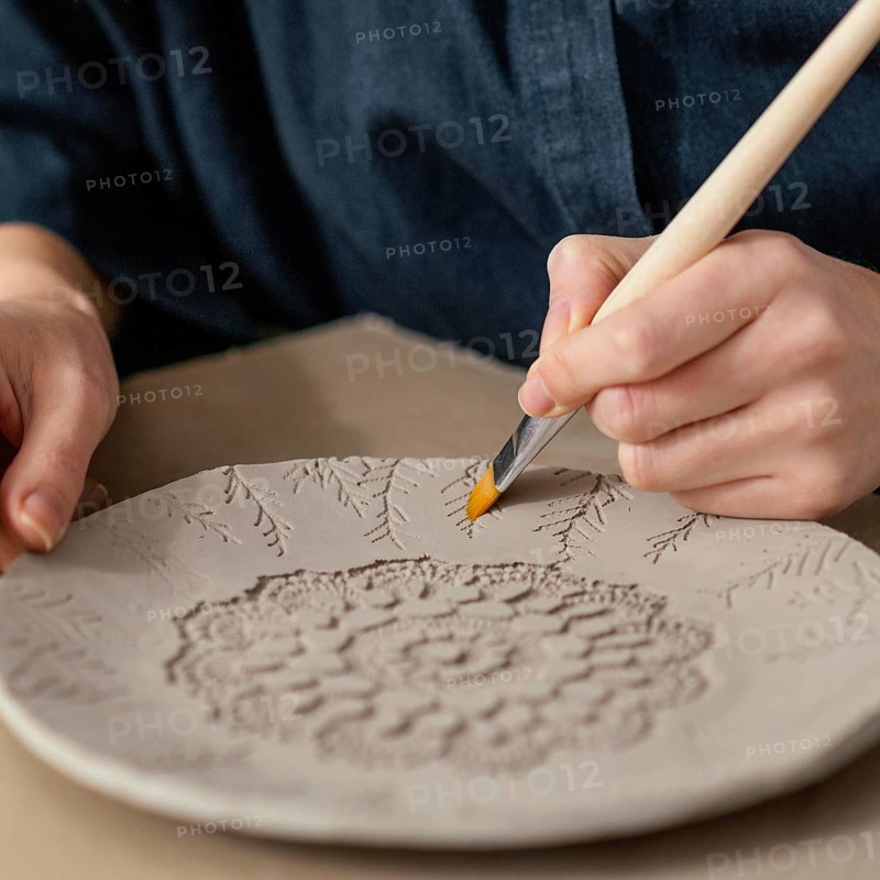 Close up hand holding brush 2