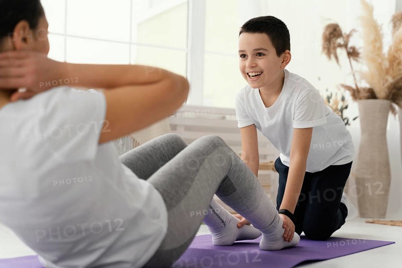 Close up kid woman training together