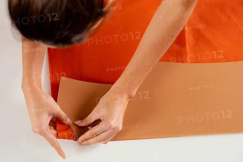 Close up woman making clothing items
