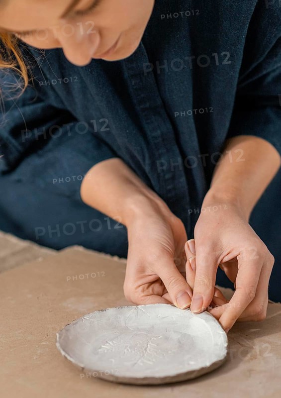 Close up woman making plate