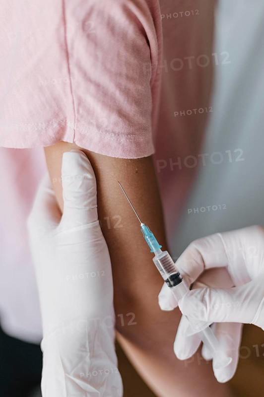Doctor giving kid vaccine