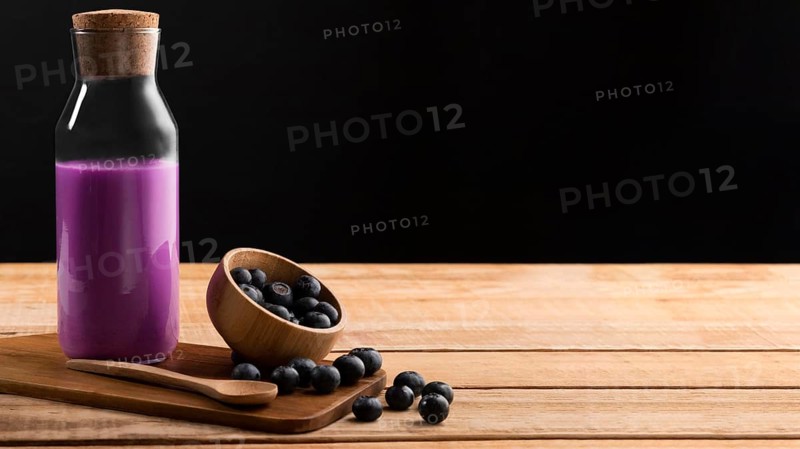 Front view purple smoothie blueberries with copy space