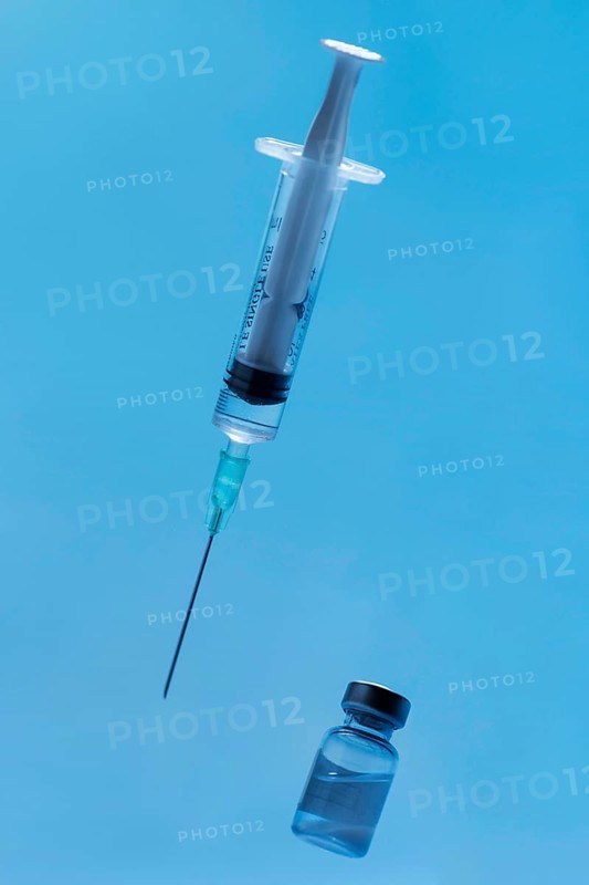 Front view syringe with vaccine close up