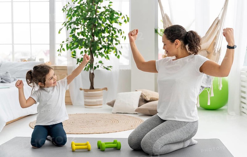 Full shot strong woman kid