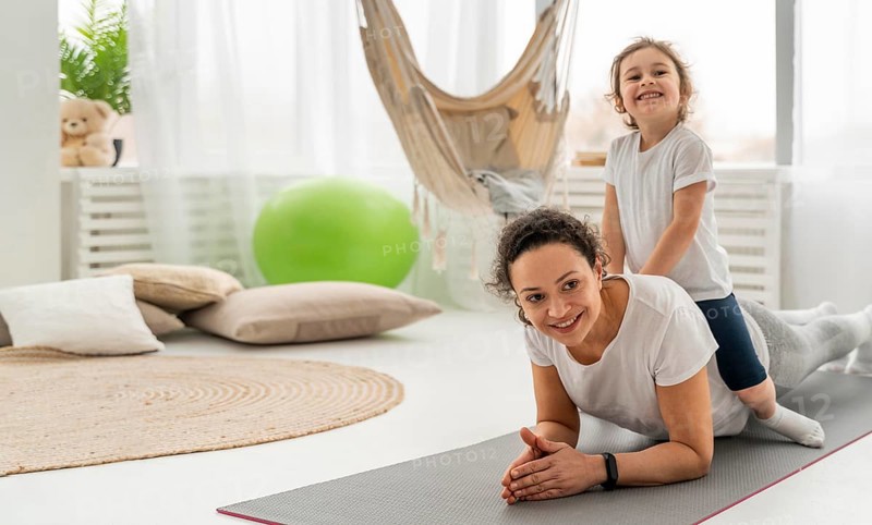 Full shot woman kid mat