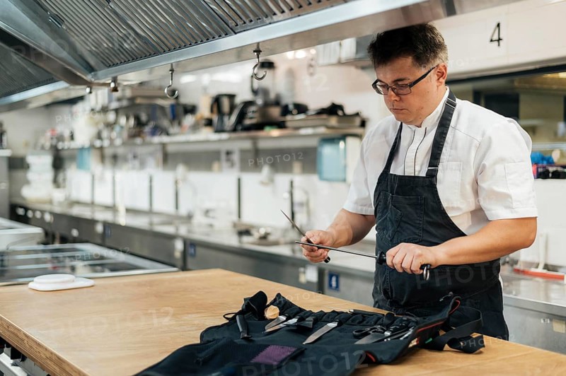 Male chef kitchen preparing his tools