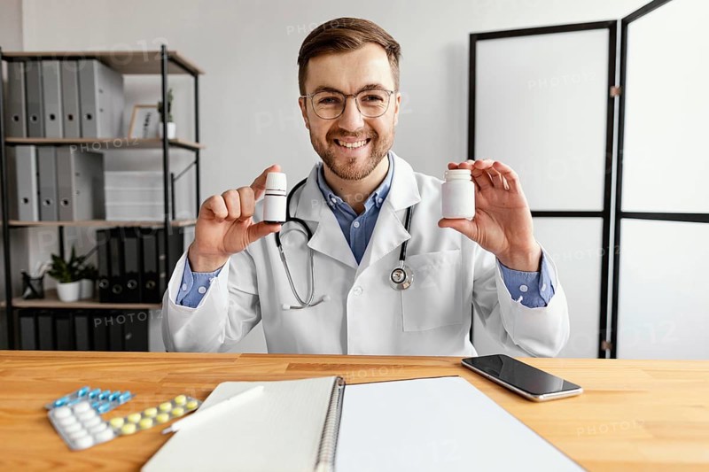 Medium shot doctor holding medicine 2