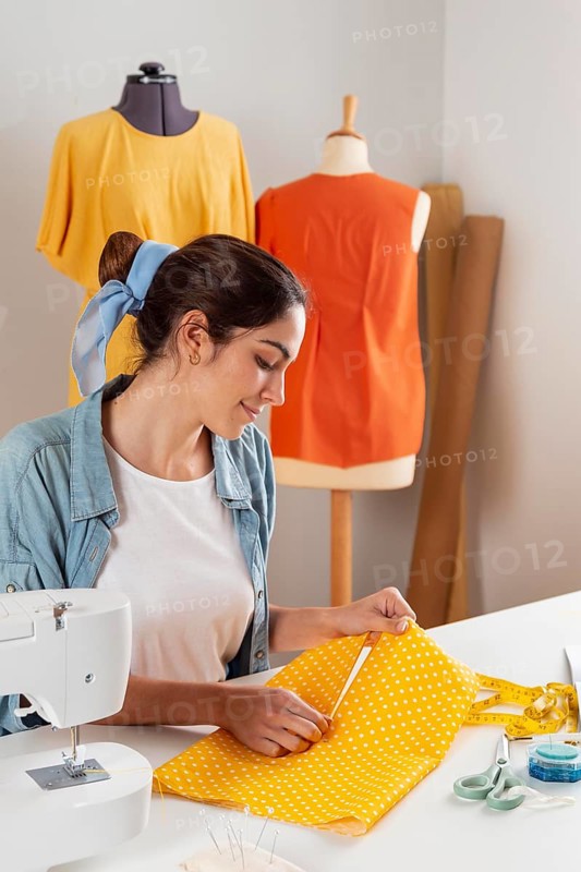 Medium shot woman holding fabric