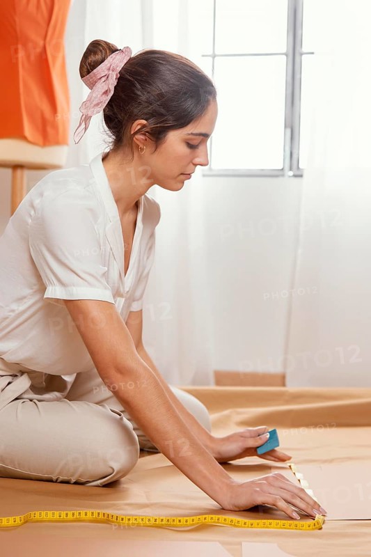 Medium shot woman measuring