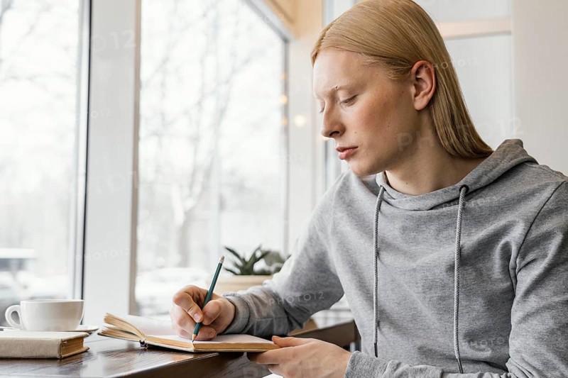 Medium shot woman writing notebook