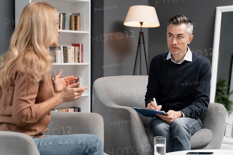 Mid shot woman talking man therapist