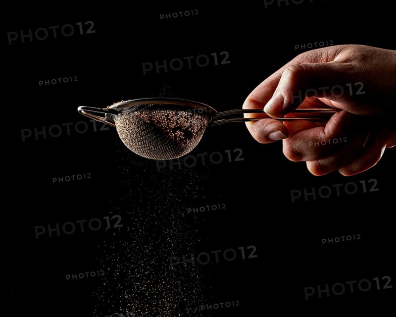 Person using tool chocolate cake