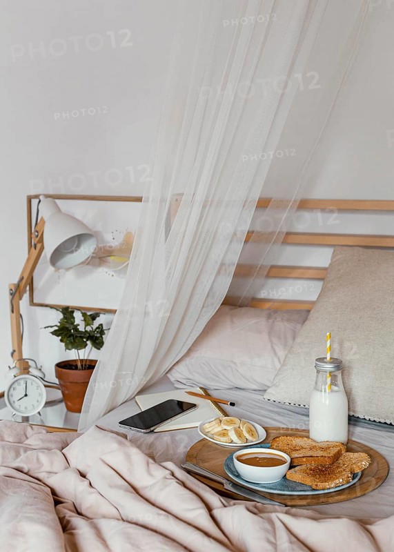 Tasty breakfast bed high angle
