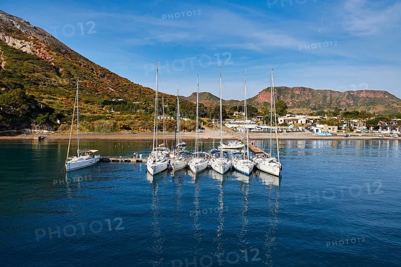 Sailboats in a row next to each other