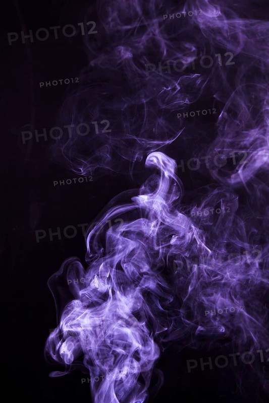 Soft focus smoke swirling black background