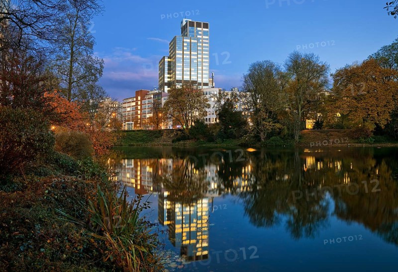 The LVA main building reflected in the Kaiserteich in autumn in the evening