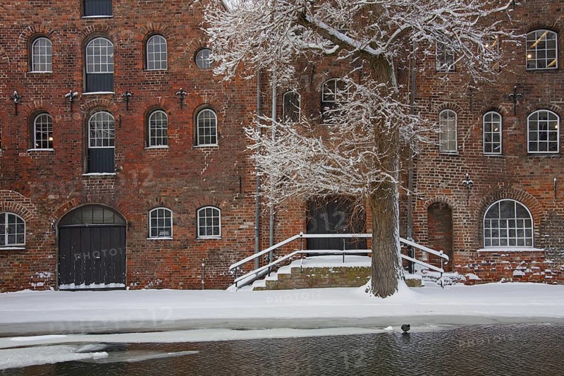 Historic salt warehouses in the snow in winter