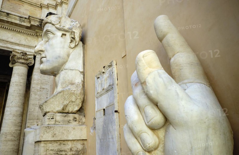 Colossal hand with index finger and head