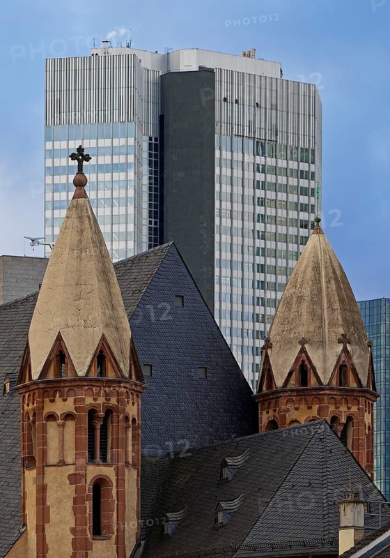 Old Catholic church of St Leonhard in front of modern skyscrapers