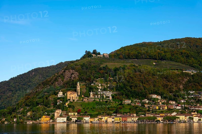 Beautiful Village Morcote witha Chucrh and Castle on Lake Lugano and Mountainscape with blue Clear sky in Morcote
