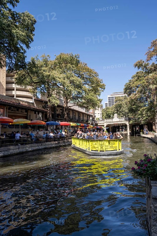 Tourists and boat at the Riverwalk
