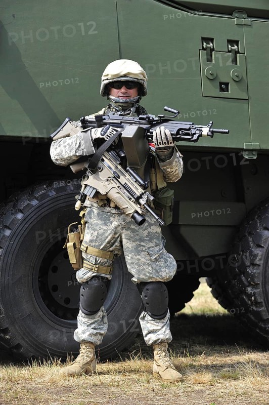 Army enthousiast wearing desert camouflage combat uniform during open day of the Belgian army at Leopoldsburg