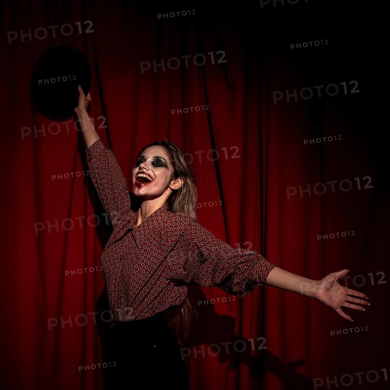 Side view woman dressed as clown being happy