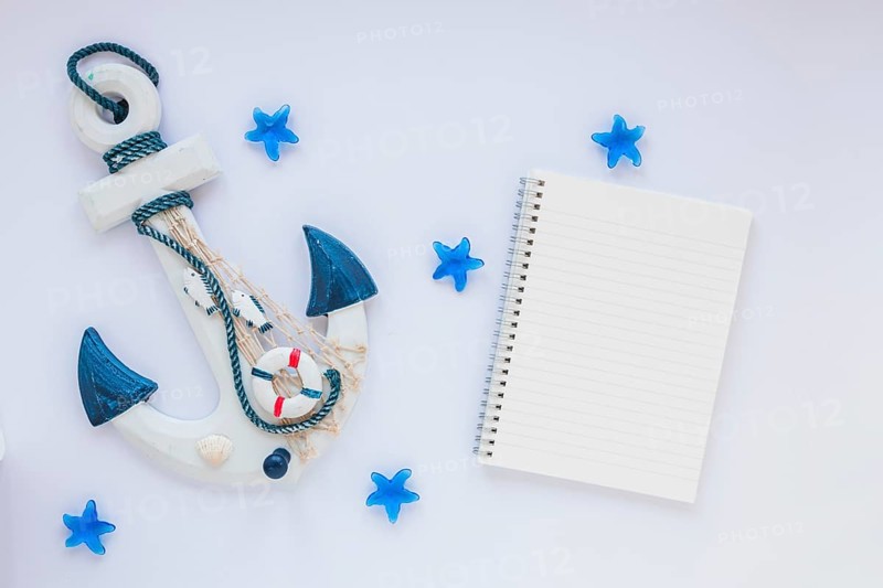 Small wooden anchor with blank notebook