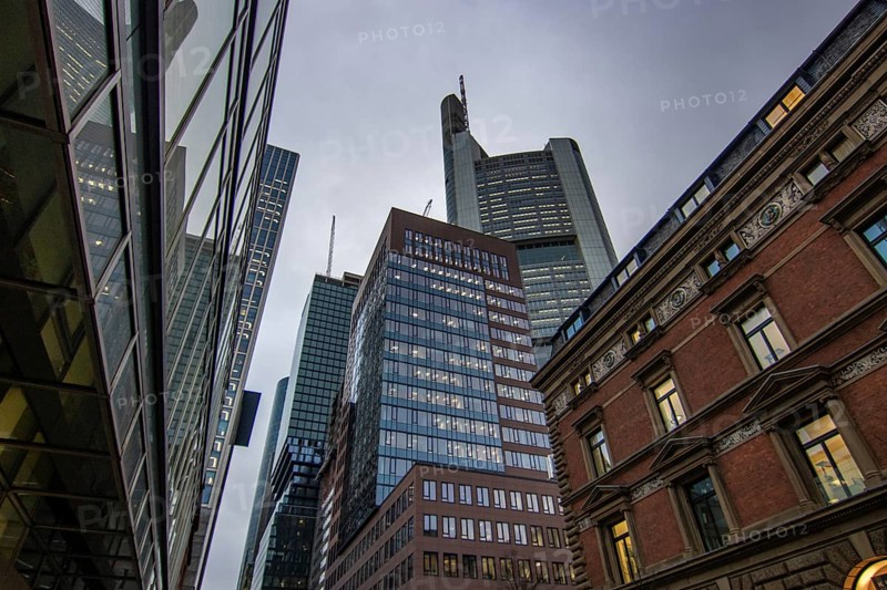 Reflection in a puddle between a historic city centre. Cityscape at the Roemer and the historic houses and streets. Cityscape in Frankfurt am Main