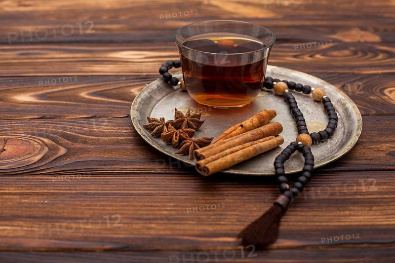 Tea cup with cinnamon rosary beads plate