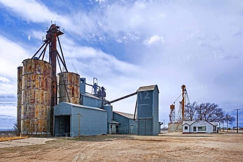 Silos connected to a grain elevator on a farm near the village Melrose in Curry County