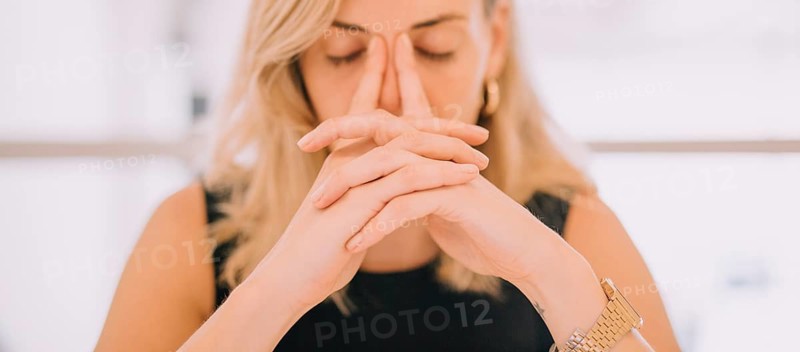 Close up young businesswoman with hands face