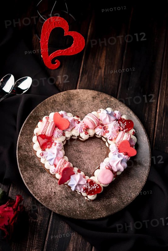 Valentines day heart shaped cake with macarons