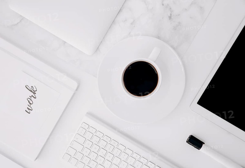 Work text diary digital tablet coffee cup keyboard black marker white desk