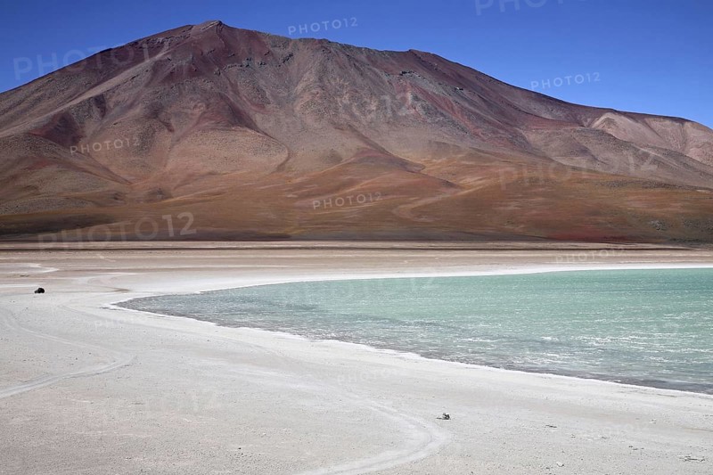 Four-wheel drive vehicle driving on dirt-track along the Laguna Verde