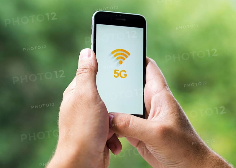 Phone with 5g screen held hands