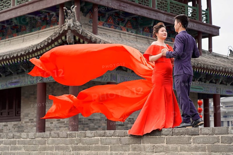 Wedding couple standing on the city wall in Xian