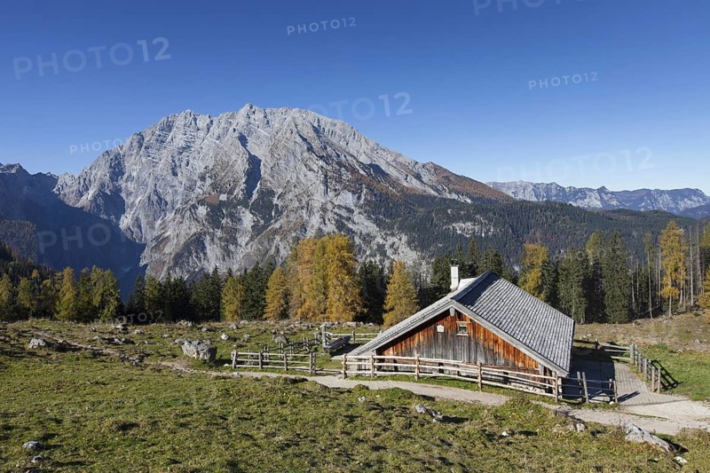 Mount Watzmann and wooden hut at Priesbergalm in the Berchtesgaden National Park