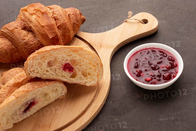 Sweet croissants with jam close up