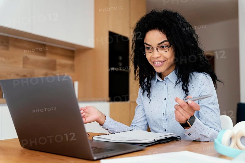 Teenage girl home during online school with laptop