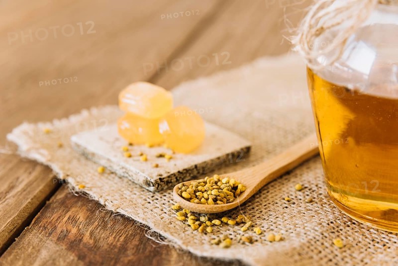 Wooden spoon bee pollen seeds candies jar honey sack cloth